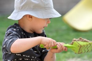 Sand in Play Therapy: Child in a sandbox